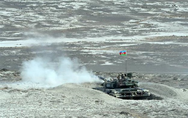 An Azeri tank fires during a military exercise.