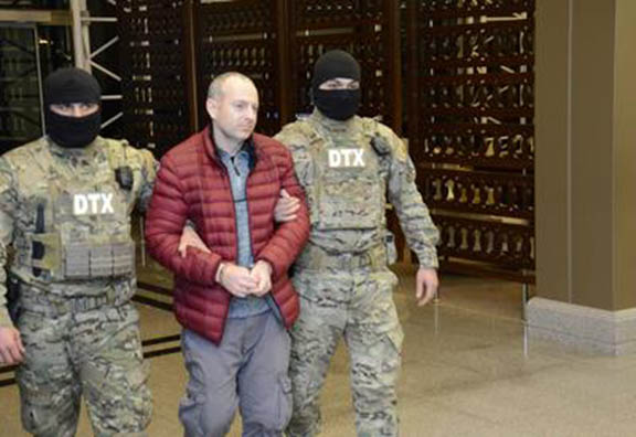 Blogger Alexander Lapshin being escorted by Azeri special forces upon his arrival in Baku on February 7