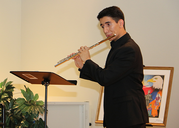 Flutist Arin Sarkissian from Crescenta Valley High School performs during the reception