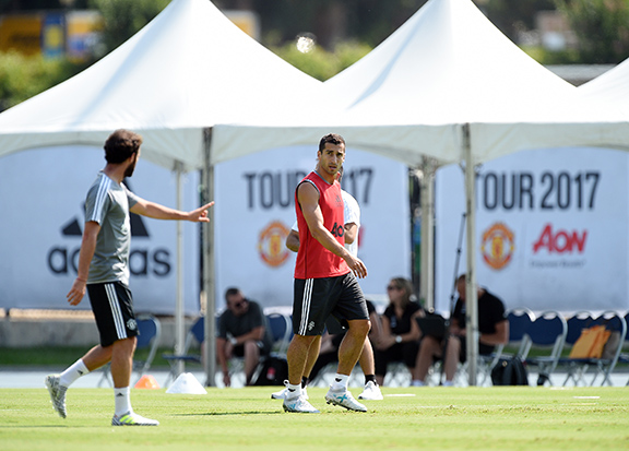 Henrikh Mkhitaryan #22 of Manchester United listens to teammate Juan Mata # 8 during training in Los Angeles, July 10, 2017. (PHOTO BY KEVORK DJANSEZIAN)