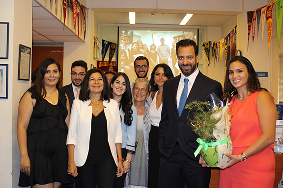 Guy Manoukian is welcomed with a small cedar tree during his visit with AMIDEAST board members Asma Zein and Wafa Saab and several scholarship recipients