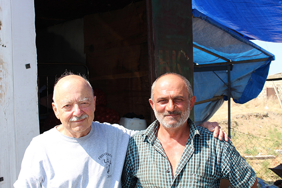 Author (left) with freedom fighter Vahan (right) at his fruit stand near Tigranakert, Artsakh.