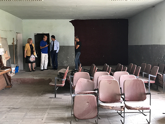 Left to right Sirvard Hamparyan, Ministry of the Diaspora, Richard Norsigian, Nor Keghi Assoc., Ara Simonyan, Minister of the Kotayik Ministry of Culture discussing the renovation of the multipurpose room in which they are standing