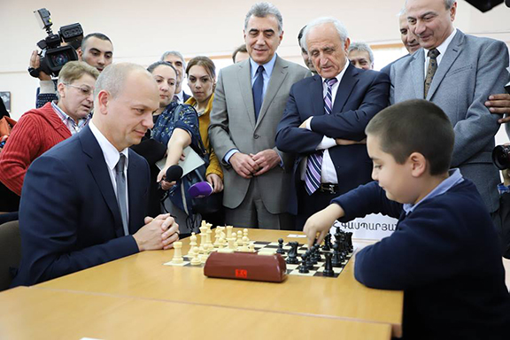 Narek Khachatryan plays chess with Tony Fadell, the American tech innovator