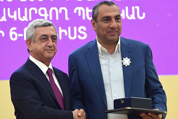 Former president Serzh Sarkisian awards Samvel Aleksanyan--Lfik Samo--a medal in 2015