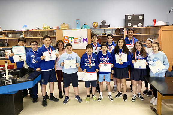 Chamlian Armenian School students holding metals and awards won at the Science Fair
