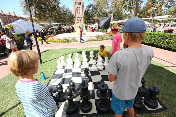 Children play chess at a past Innovate Armenia event 