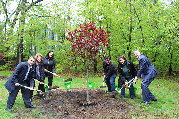 Left to right: Boston City Councilor Frank Baker, Armenia Tree Project Founder Carolyn Mugar, Armenia Tree Project Executive Director Jeanmarie Papelian, Dorchester Park Association Board Members David Mareira, Lisa Ahern, and Middlesex County Sheriff Peter Koutoujian plant a Cherry Tree in Boston’s Dorchester Park