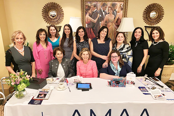Michèle Simourian surrounded by Boston OC Committee members and AMAA representatives