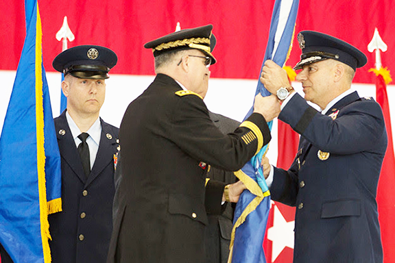 Supreme Allied Commander Europe, General Curtis M. Scaparrotti (front left) hands command of Allied Air Command to General Jeffrey L. Harrigian (front right) during a change of command ceremony