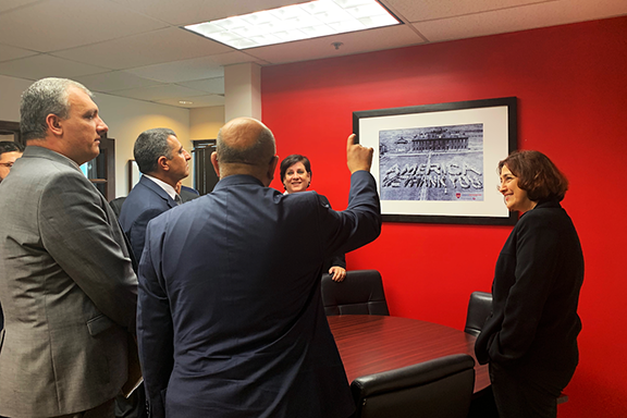 ANCA-WR Chair Nora Hovsepian, Esq. showing a photo of orphans spelling out "America We Thank You" at a Near East Relief orphanage following the Armenian Genocide to Ambassador Nersesyan, Consul General Dr. Baibourtian, and Counselor Pahlavuni