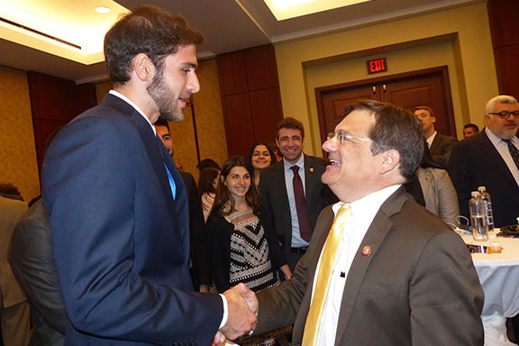 ANCA Leo Sarkisian intern Greg Mikhanjian chatting with Congressional Armenian Caucus Co-Chair Gus Bilirakis at ecumenical prayer held at the Capitol Rotunda, organized by In Defense of Christians