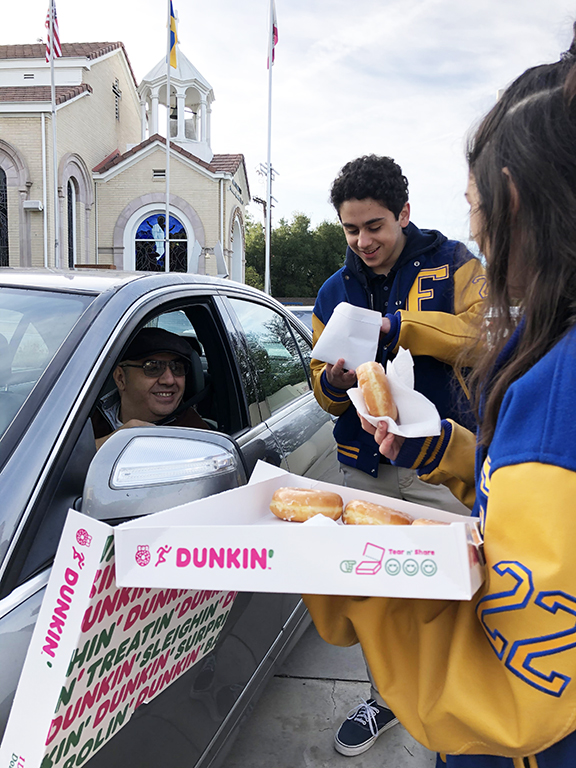 The high school students sold coffee and donuts to parents in order to raise money for Groceries for Gyumri