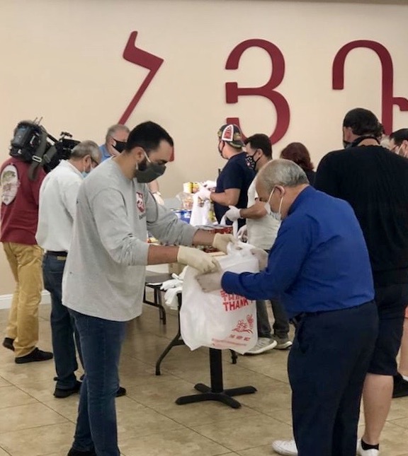Members of the ARF Hollywood Karekin Njdeh gomideh were joined by St. Garabed Church pastor Archpriest Vicken Vassilian to prepare care packages for community members