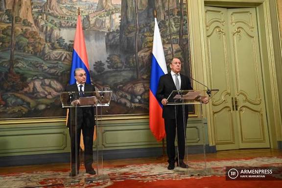 Armenia's Foreign Minister Zohrab Mnatsakanyan (left) and his Russian counterpart Sergei Lavrov hold a joint press conference in Moscow on Oct. 12